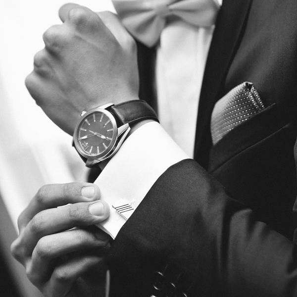Bigstock man with suit and watch on han 629041601